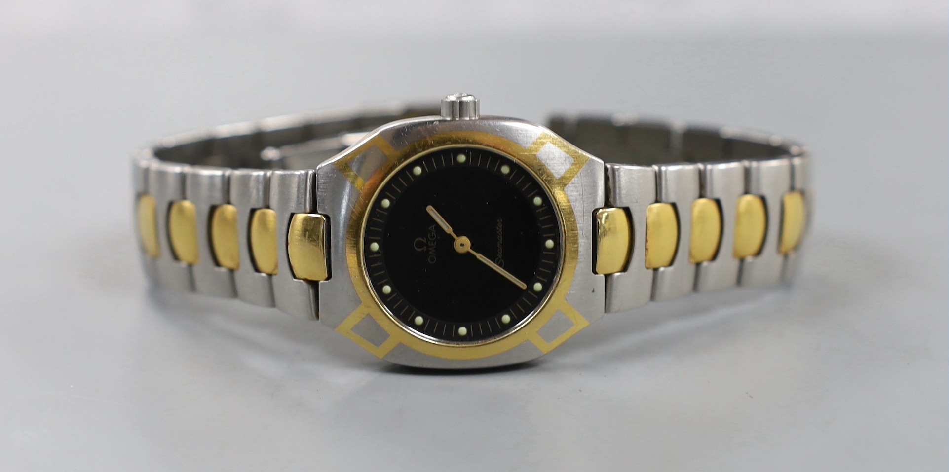 A gentleman's modern steel and gold plated Omega Seamaster quartz wrist watch, case diameter 32mm, with box, no papers.